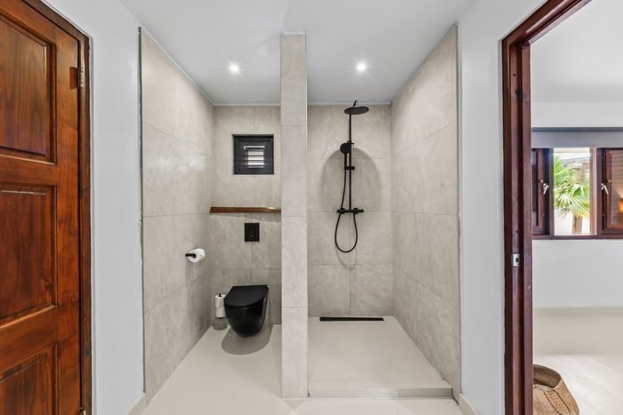 Walk-in shower in natural stone