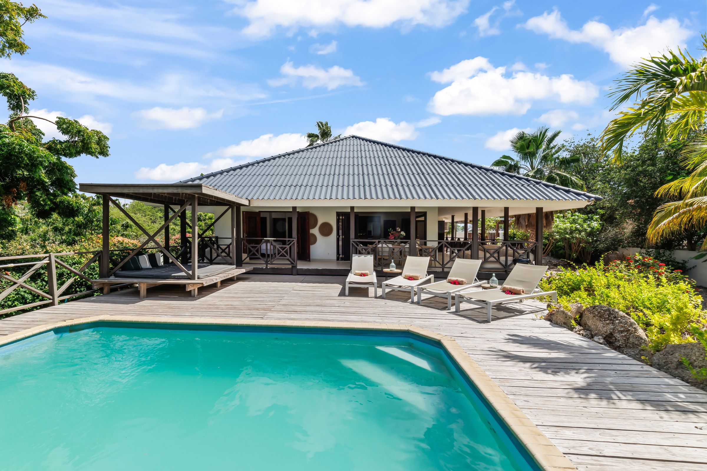 The pool with the house behind it