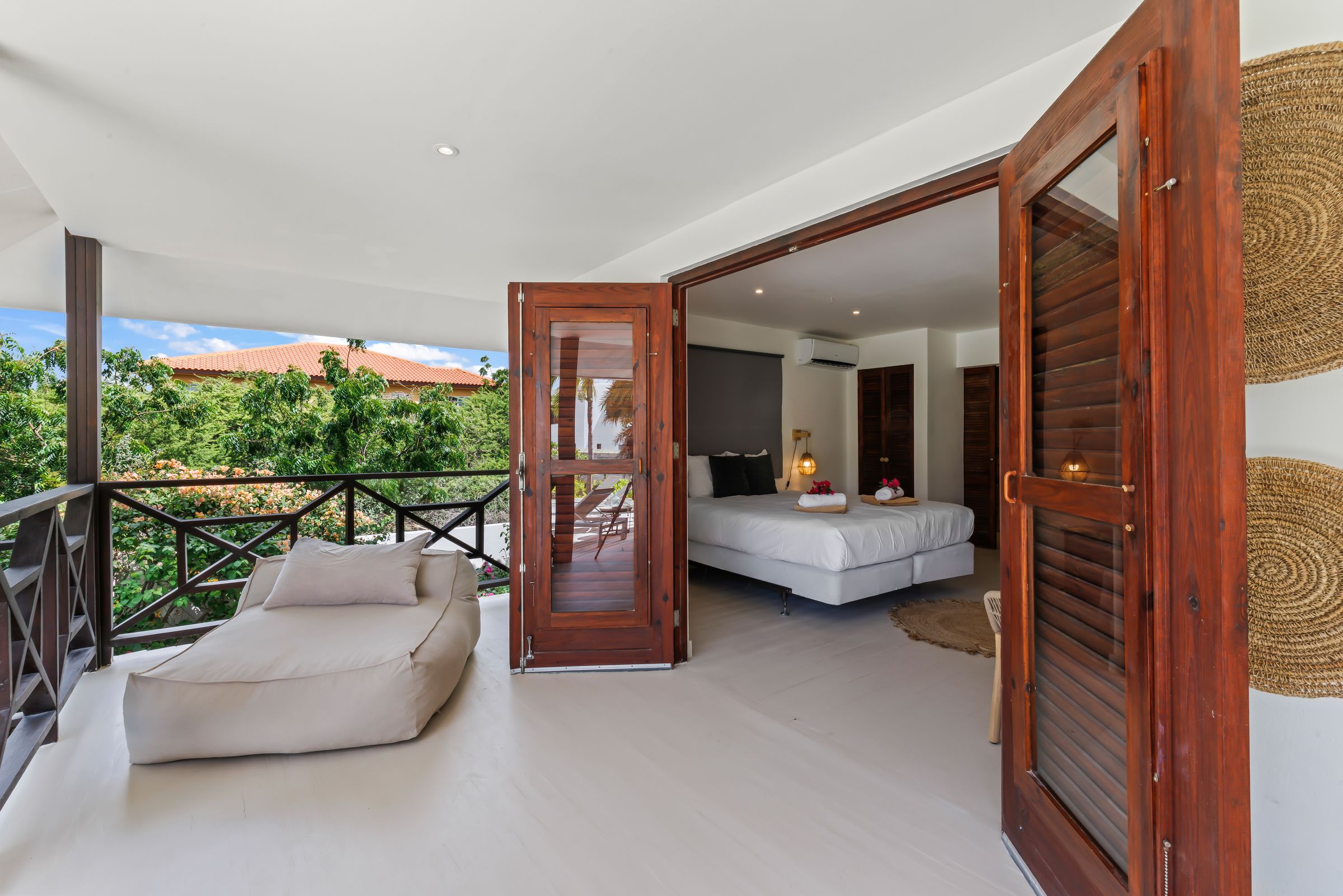 Open bedroom doors onto the veranda