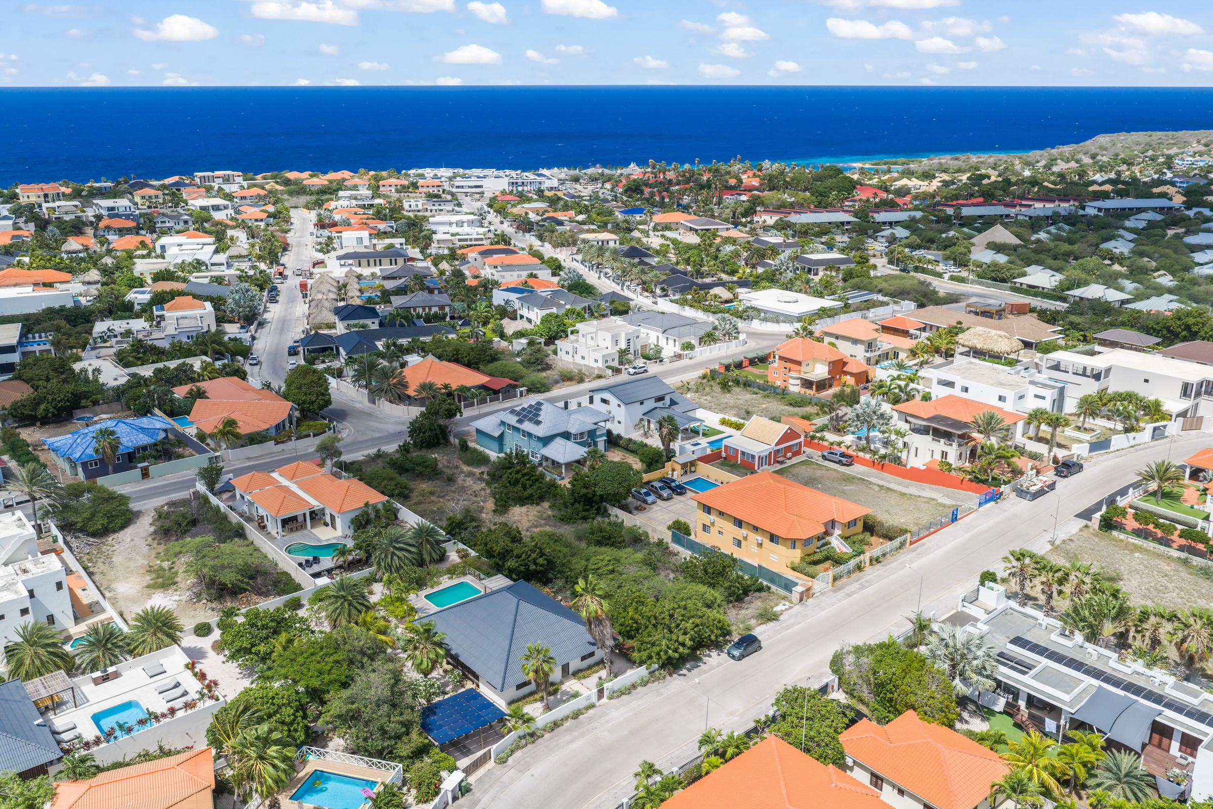Aerial view over the neighbourhood with the Caribbean Sea on the horizon