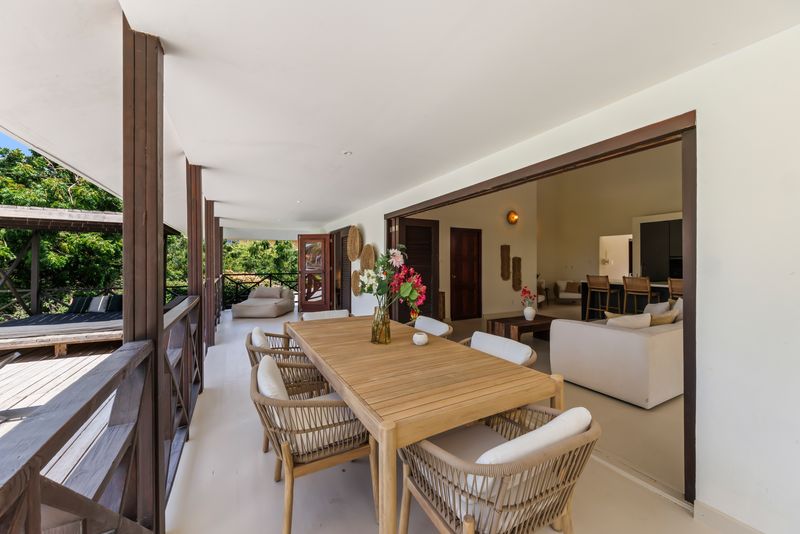 The dining table on the veranda overlooking the pool