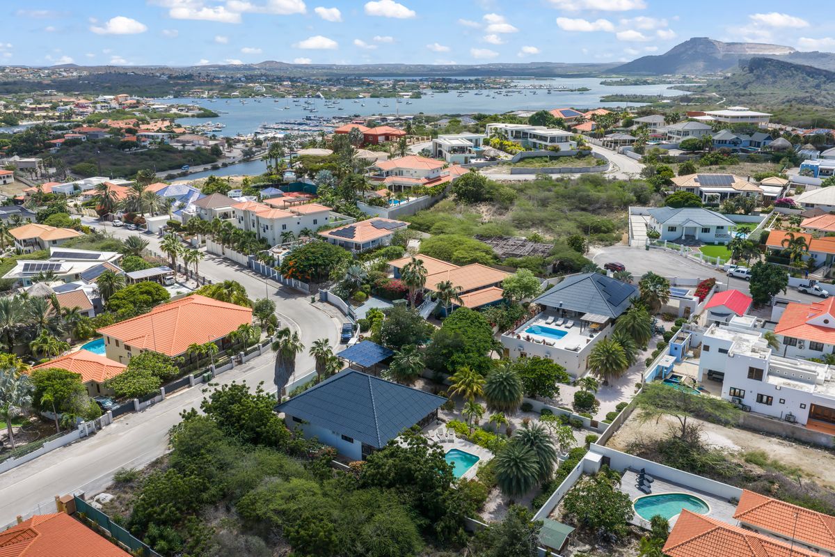 Aerial view across the neighbourhood towards the bay and the hills